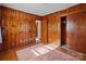 Bedroom with wood walls and built in closet at 200 11Th St, Spencer, NC 28159