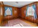 Bedroom with wood paneled walls and small rug at 200 11Th St, Spencer, NC 28159