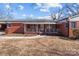 Front porch of a brick ranch house at 200 11Th St, Spencer, NC 28159