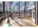 Large backyard with deck, playset, and firepit at 2000 Shannon Bridge Ln, Matthews, NC 28105