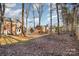 Large backyard with playset and trees at 2000 Shannon Bridge Ln, Matthews, NC 28105
