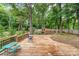Beautiful backyard featuring a spacious wooden deck, outdoor seating, and a play area at 2000 Shannon Bridge Ln, Matthews, NC 28105