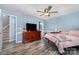 This main bedroom boasts wood-look floors and a light-filled atmosphere at 2000 Shannon Bridge Ln, Matthews, NC 28105