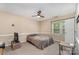 Cozy bedroom featuring carpeted floors, a ceiling fan, and natural light from a window at 2000 Shannon Bridge Ln, Matthews, NC 28105
