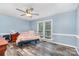 This bedroom boasts wood-look floors and a light-filled atmosphere at 2000 Shannon Bridge Ln, Matthews, NC 28105