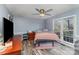 Bright bedroom featuring a ceiling fan and large window at 2000 Shannon Bridge Ln, Matthews, NC 28105