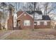 Two-story brick home with a charming front porch and walkway at 2000 Shannon Bridge Ln, Matthews, NC 28105