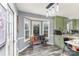 Eat-in kitchen featuring a bay window and green shaker cabinets at 2000 Shannon Bridge Ln, Matthews, NC 28105
