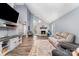 Bright living room features a brick fireplace, vaulted ceiling, large windows and wood-look floors at 2000 Shannon Bridge Ln, Matthews, NC 28105