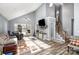 Bright living room with hardwood floors, high ceilings, and staircase at 2000 Shannon Bridge Ln, Matthews, NC 28105