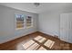 Bright bedroom with hardwood floors and large windows at 2042 Country Ct, Rock Hill, SC 29732