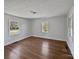 Spacious bedroom with hardwood floors and multiple windows at 2042 Country Ct, Rock Hill, SC 29732