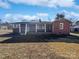 Brick ranch house with covered porch and large yard at 2042 Country Ct, Rock Hill, SC 29732