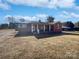 Brick ranch house with covered porch and large yard at 2042 Country Ct, Rock Hill, SC 29732