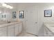 Bathroom with marble countertop vanity, featuring modern art on the walls at 212 Bacon Ave, Charlotte, NC 28208