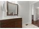Modern bathroom showcasing single vanity with wooden cabinets and sleek countertop at 212 Bacon Ave, Charlotte, NC 28208