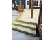 New wood deck features stairs, decorative railing, and concrete patio at 212 Bacon Ave, Charlotte, NC 28208