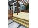 New wooden deck with pergola and horizontal railings overlooks a paved patio at 212 Bacon Ave, Charlotte, NC 28208