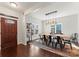 Dining room with natural light, modern light fixture, and sleek wood floors at 212 Bacon Ave, Charlotte, NC 28208