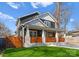 Inviting two-story home featuring a covered front porch and well-manicured lawn at 212 Bacon Ave, Charlotte, NC 28208