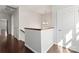 Upstairs hallway featuring hardwood floors, neutral walls, and access to several rooms at 212 Bacon Ave, Charlotte, NC 28208