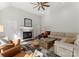 Comfortable living room with modern fireplace, hardwood floors, and plenty of seating at 212 Bacon Ave, Charlotte, NC 28208