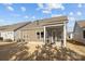 Backyard featuring a patio and lush green lawn, perfect for outdoor activities at 240 Portrait Way # 87, Indian Trail, NC 28079