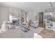 Open-concept living room with fireplace, comfortable seating, hardwood floors, and seamless flow to the kitchen at 240 Portrait Way # 87, Indian Trail, NC 28079