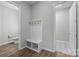 Mudroom featuring hall tree, bench seating, coat hooks, and adjacent half-bathroom at 240 Portrait Way # 87, Indian Trail, NC 28079