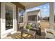 Outdoor patio with wicker furniture and a view of the well-maintained backyard at 240 Portrait Way # 87, Indian Trail, NC 28079