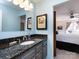 Bathroom with granite countertop, updated vanity, and a large mirror at 308 Queens Rd # 25, Charlotte, NC 28204