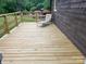 Newly constructed back deck features wood rails and ample space for outdoor furniture and entertaining guests at 3510 Flint Dr, Statesville, NC 28677