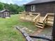 A newly constructed back deck, accessed by steps, overlooks a well-maintained yard and storage shed at 3510 Flint Dr, Statesville, NC 28677