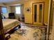 Comfortable bedroom with a large floral rug and closet, offering ample space for relaxation at 3510 Flint Dr, Statesville, NC 28677