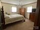 Comfortable bedroom with classic furniture, soft lighting, and a peaceful ambiance at 3510 Flint Dr, Statesville, NC 28677