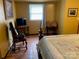 The bedroom features wood laminate floors and a large comfortable bed at 3510 Flint Dr, Statesville, NC 28677
