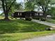 Charming single-story home features a well-maintained lawn, mature trees, and a long driveway at 3510 Flint Dr, Statesville, NC 28677