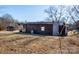 Brown house exterior with shed and landscaping at 3510 Flint Dr, Statesville, NC 28677