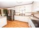 Bright kitchen features stainless steel fridge and functional layout, ready for culinary adventures at 3510 Flint Dr, Statesville, NC 28677