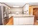 Updated kitchen with stainless steel appliances and an island at 3510 Flint Dr, Statesville, NC 28677