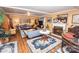 Spacious living room featuring hardwood floors, a fireplace, and ample seating at 3510 Flint Dr, Statesville, NC 28677
