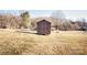 Brown storage shed in backyard; great for extra storage at 3510 Flint Dr, Statesville, NC 28677