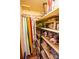 Organized walk-in closet featuring shelving and hanging rods for clothing and accessories at 3510 Flint Dr, Statesville, NC 28677