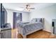 Bedroom with hardwood floors, neutral walls, and a ceiling fan at 352 Palmer Cir, Rockwell, NC 28138