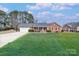 Brick ranch home with attached garage and spacious lawn at 352 Palmer Cir, Rockwell, NC 28138