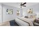 Cozy bedroom with neutral decor, ceiling fan, and large window at 3701 Catawba Creek Dr, Gastonia, NC 28056