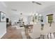 Open concept dining area with tile floor and modern light fixture at 3701 Catawba Creek Dr, Gastonia, NC 28056