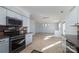 Open concept kitchen with stainless steel appliances and a view to the dining area at 3701 Catawba Creek Dr, Gastonia, NC 28056