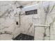 Modern shower with marble tile and hexagonal floor at 3701 Catawba Creek Dr, Gastonia, NC 28056