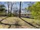 Backyard featuring a well-maintained lawn and partial perimeter fencing at 3843 Foxford Pl, Charlotte, NC 28215